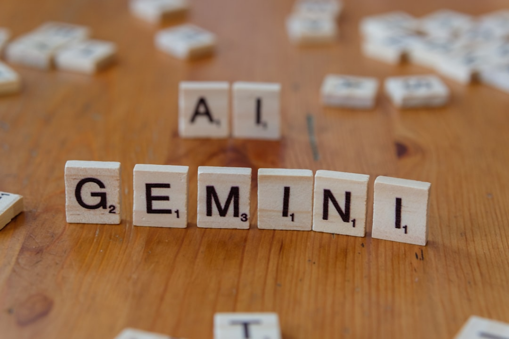 A wooden table topped with scrabble tiles that spell out the word all gen — Foto por Markus Winkler na Unsplash
