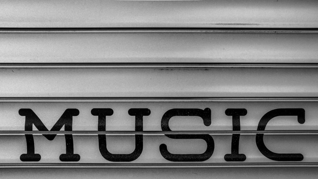 a close up of the word music written in black and white — Foto por Kind and Curious na Unsplash