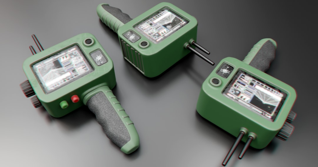 Three green medical devices on a gray surface — Foto por Michael Mwangi na Unsplash