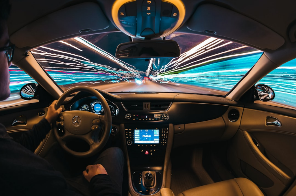 time lapse photography of man riding car — Foto por Samuele Errico Piccarini na Unsplash